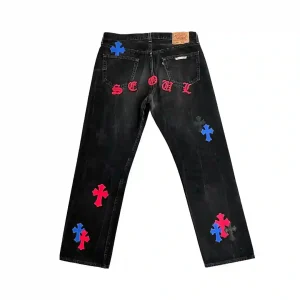 Chrome Hearts x Levi's 501 Seoul Exclusive black denim jeans featuring red and blue leather cross patches and Gothic SEOUL embroidery on the back pockets.
